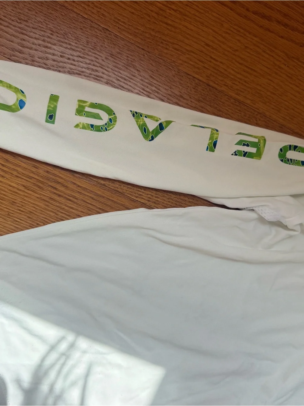 Pelagic Kids White Rashguard with Green Logo